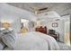 Main bedroom with a large bed, dresser, and ensuite bathroom access at 210 N Church St # 1213, Charlotte, NC 28202