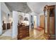 Entryway with wood floors, a cabinet, and views into other rooms at 210 N Church St # 1213, Charlotte, NC 28202