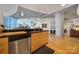 Modern kitchen with stainless steel appliances and light wood cabinets at 210 N Church St # 1213, Charlotte, NC 28202