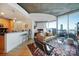 Spacious living room with hardwood floors and city views at 210 N Church St # 1213, Charlotte, NC 28202