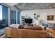 Living room with hardwood floors and city views at 210 N Church St # 1213, Charlotte, NC 28202
