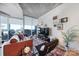 Living room with hardwood floors and city views at 210 N Church St # 1213, Charlotte, NC 28202
