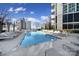 Refreshing rooftop swimming pool with plenty of lounge chairs at 210 N Church St # 1213, Charlotte, NC 28202