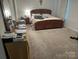 Bright bedroom with a king-size bed and dresser at 3173 Green Apple Dr, Dallas, NC 28034