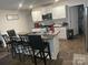 Modern kitchen with white cabinets and granite countertops at 3173 Green Apple Dr, Dallas, NC 28034