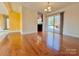 Dining room with hardwood floors and sliding glass door to deck at 99 Poplar Grove Ct, Taylorsville, NC 28681