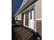 Brown front door with a glass insert and stone accents at 99 Poplar Grove Ct, Taylorsville, NC 28681