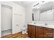 Bathroom with double vanity and linen closet at 109 Berrybeth Cir, China Grove, NC 28023