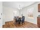 Dining room with a round wooden table and four black chairs at 109 Berrybeth Cir, China Grove, NC 28023