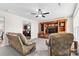 Living room with two leather recliners and a large entertainment center at 109 Berrybeth Cir, China Grove, NC 28023