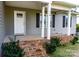 Brick steps leading to a covered front porch with white columns at 118 Cypress Acres Ln, Statesville, NC 28625