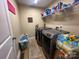 Laundry room with washer, dryer, and shelving at 118 Cypress Acres Ln, Statesville, NC 28625