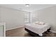 Simple bedroom with a queen-size bed and neutral decor at 132 Kingsway Dr, Mooresville, NC 28115