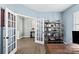 Home office with built-in shelving, wood desk, and window with blinds at 132 Kingsway Dr, Mooresville, NC 28115