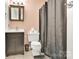 Bathroom with dark vanity, toilet and shower/tub at 155 Country Ln, Mooresville, NC 28115