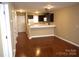 Hardwood floors and kitchen bar in an open living area at 1646 Eagles Pl # H 101, Rock Hill, SC 29732