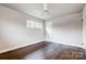 Well-lit bedroom with hardwood floors and a ceiling fan at 2504 Juniper Dr, Charlotte, NC 28269