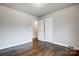 Bright bedroom with hardwood floors and double closets at 2504 Juniper Dr, Charlotte, NC 28269