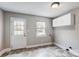 Laundry room with exterior access and overhead cabinets at 2504 Juniper Dr, Charlotte, NC 28269