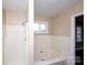 Updated bathroom with a shower and bathtub combo, plus a window at 3001 Austin Chaney Rd, Monroe, NC 28110