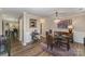 Elegant dining room with a glass table, chandelier, and hardwood floors at 4140 Trowel Ct, Midland, NC 28107