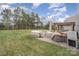 Landscaped backyard with pergola and patio furniture at 4140 Trowel Ct, Midland, NC 28107