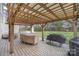 Covered patio area with pergola, outdoor furniture, and grill at 4140 Trowel Ct, Midland, NC 28107