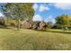 Brick ranch home situated on a large lot with a tree-lined yard at 4330 Whitetail Ln, Midland, NC 28107