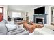 Spacious living area with a fireplace and comfortable seating arrangement at 4605 General Pershing Dr, Charlotte, NC 28209