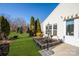 Landscaped backyard with a raised garden bed and bird bath at 5981 Bison Ct, Fort Mill, SC 29707