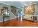 Spacious entryway with hardwood floors, a bench, and a staircase at 5981 Bison Ct, Fort Mill, SC 29707