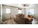 Bright living room featuring tiled floors, comfy seating, and a large window at 6212 Snowcrest Ct, Charlotte, NC 28212