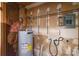 Utility room with water heater and electrical panel at 6212 Snowcrest Ct, Charlotte, NC 28212