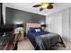 Bedroom with a queen bed, ceiling fan, and home office space at 6638 Kingbird Ct, Charlotte, NC 28215