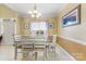 Dining room with hardwood floors, chandelier, and view of the entryway at 6638 Kingbird Ct, Charlotte, NC 28215