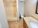 Bathroom includes a bathtub, shower, granite countertop, and toilet at 7306 Bramblewood Dr, Charlotte, NC 28217