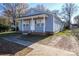 Cute blue house with a porch and brick base at 804 Matheson Ave, Charlotte, NC 28205