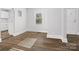 Dining area with hardwood floors and view into kitchen at 8532 Old Plank Rd, Charlotte, NC 28216