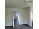 Simple bedroom with gray flooring and access to another room at 111 Dye St, Chester, SC 29706