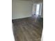 Bright living room featuring gray laminate flooring at 111 Dye St, Chester, SC 29706