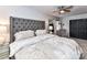 Main bedroom with tufted headboard and elegant lamps at 2725 Von Thuringer Ct, Charlotte, NC 28210