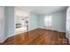 Hardwood floor dining area with kitchen and living room views at 333 W Wilson Ave, Mooresville, NC 28115