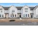 Three-story townhouses with white siding, black doors, and landscaping at 380 Bly St, Rock Hill, SC 29732