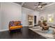 Living room with dark hardwood floors, antique furniture, and fireplace at 419 E Fisher St, Salisbury, NC 28144