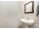 Small bathroom with pedestal sink and mirror at 4836 Pepper Dr, Harrisburg, NC 28075