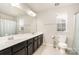 Clean bathroom with double vanity and large mirror at 4836 Pepper Dr, Harrisburg, NC 28075