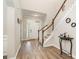 Bright entryway with hardwood floors and staircase at 4836 Pepper Dr, Harrisburg, NC 28075
