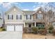 Two-story house with stone accents and a two-car garage at 4836 Pepper Dr, Harrisburg, NC 28075