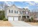 Two-story house with stone accents and a two-car garage at 4836 Pepper Dr, Harrisburg, NC 28075