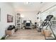 Home office with built-in shelving and hardwood floors at 4836 Pepper Dr, Harrisburg, NC 28075